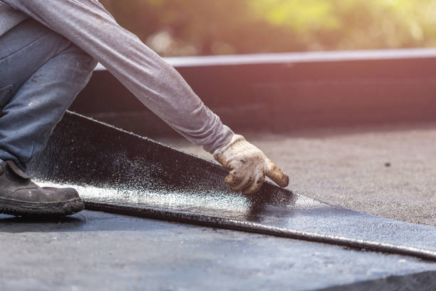 Professional Basement Waterproofing technician working in Covington, VA